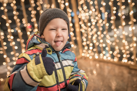 Caucasian boy is crawling and Christmas decoration is backの写真素材