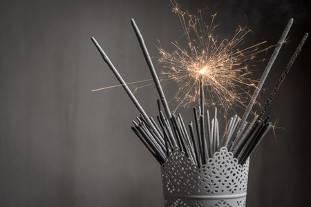 Sparklers in bowl, black and white photoの写真素材
