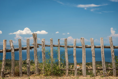 Rustic wooden fence and sky and sea is backの写真素材