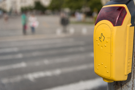 Crosswalk button for pedestrian with light warningの写真素材