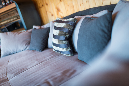 Close uo of sofa with pillows in hom interiorの写真素材