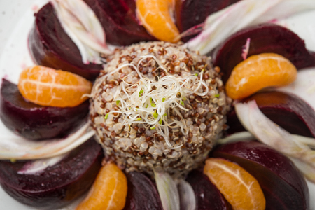 Close up of vegan dish, cooked beetroot with tangerineの写真素材