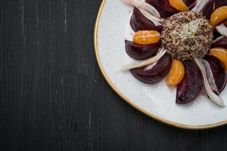 Boiled beetroot with cereals and tangerineの写真素材