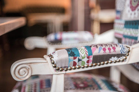 Close up furniture armrest of boho style seat