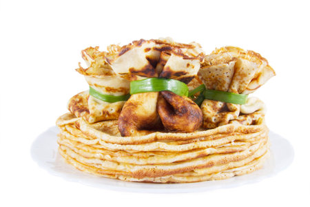 pancake in the form of sac on a pile of pancakesの写真素材