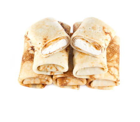 rolled pancakes with cottage cheese on a light backgroundの写真素材
