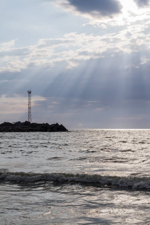 the sun's rays penetrate through clouds over the Baltic Sea, Klaipeda, Lithuaniaの写真素材