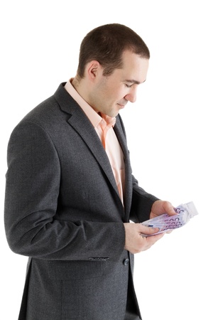 stack banknotes of 500 euro in hands of man on white backgroundの写真素材