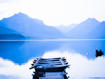 Boats on a lake with mountainsの写真素材