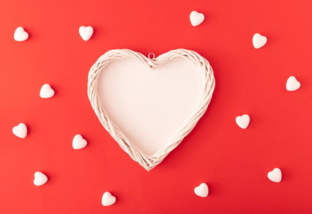 Heart Shape Frame on red background with small hearts pattern.Flat lay. Love concept.の写真素材