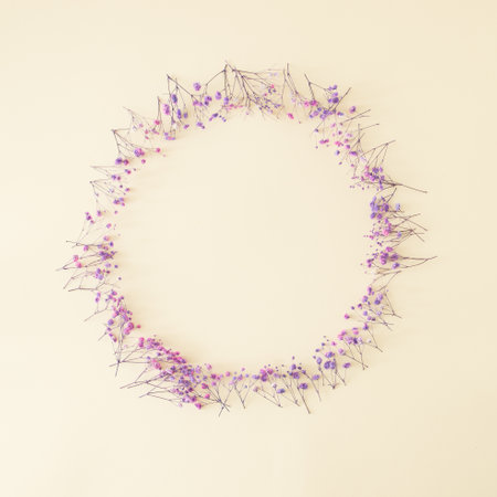 Creative circular copy space made with tiny blooming flowers.Minimal Nature and Spring concept.Flat Lay.の写真素材