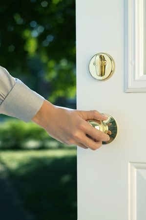Woman hand opening doorの写真素材