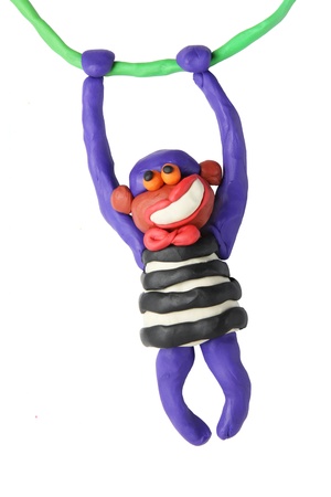 Plasticine smiling monkey on a white backgroundの写真素材