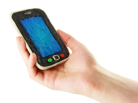 Plasticine cartoon smartphone in the handの写真素材