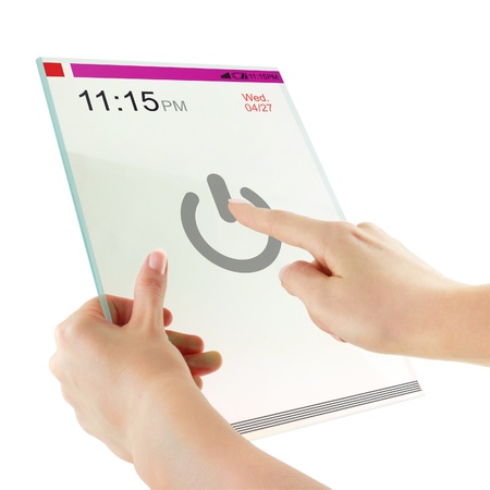 Futuristic glass digital tablet in the handsの写真素材
