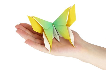 Origami butterfly in the human handの写真素材
