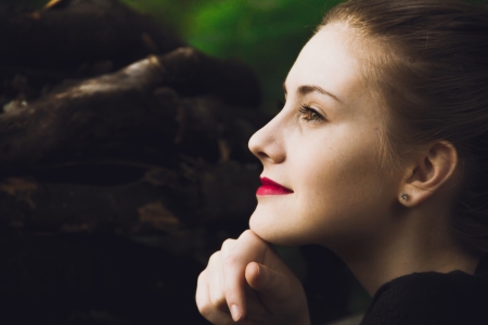 beautyfull fastion girl with red lips in forest backgroundの写真素材