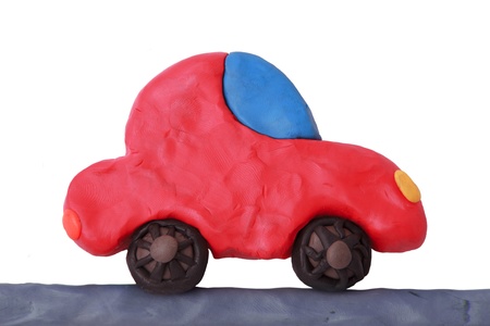 Red child plasticine ecology car on a white backgroundの写真素材