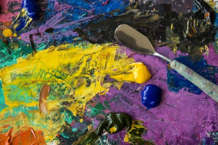 Oil paints palette with palette knifeの写真素材