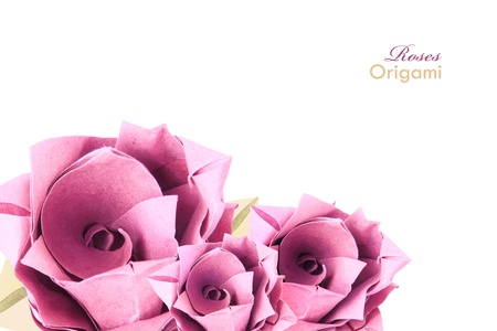 Origami paper pink vintage stile isolated roses on a white backgroundの写真素材