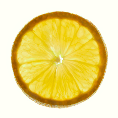 Circle section of fresh lemon on a white backgroundの写真素材