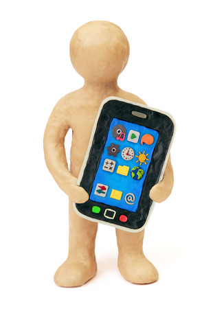 Plasticine man with smart phone mobile and icons on a white backgroundの写真素材