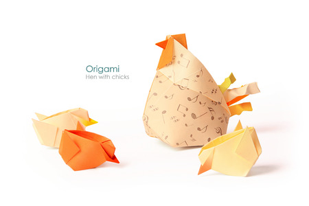 Care hen with chicks origami on white の写真素材