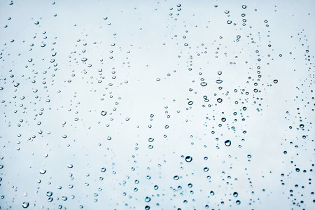 Water rain drops blue fresh wet window backgroundの写真素材