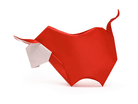 Origami red horned furious bull on a white backgroundの写真素材