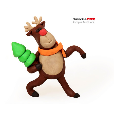 Plasticine cartoon deer with present cristmas tree on a white backgroundの写真素材