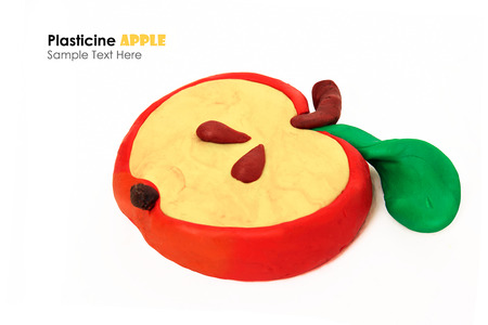 Plasticine cartoon apple slice on a white backgroundの写真素材