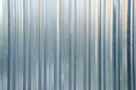 Metal shiny silver textured abstract reflection backgroundの写真素材