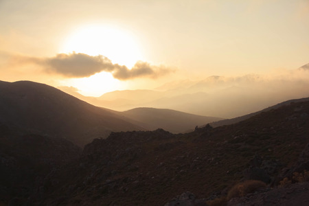 Sky clouds mountain silhouette rock sunset tranquil freedom sceneの写真素材