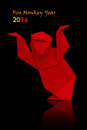 2016 new year symbol origami red monkey on a black backgroundの写真素材