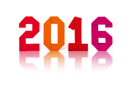 New year 2016 paper origami numbers on a confetti exploding white background