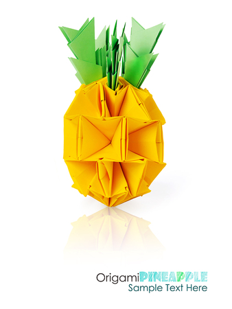 Origami paper pineapple yellow vitamin diet tropical fruit on a white backgroundの写真素材