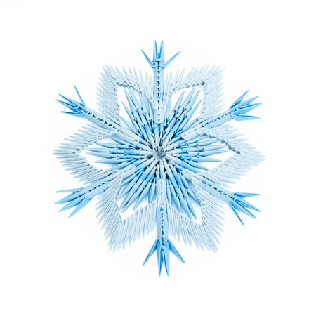 Origami paper fragility ice blue christmas winter cold snowflakes on a white backgroundの写真素材