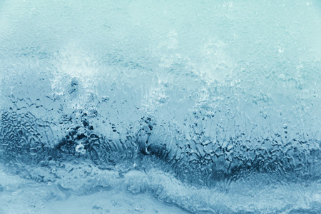 Textured ice blue frozen water winter backgroundの写真素材