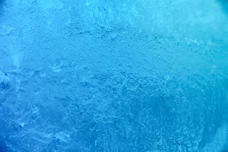 Textured ice dark blue frozen winter backgroundの写真素材