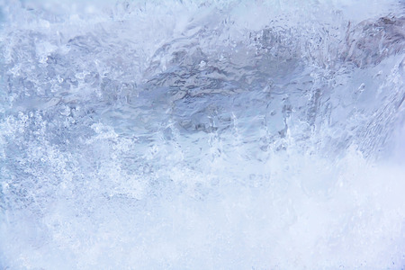 Textured ice dark blue frozen winter backgroundの写真素材