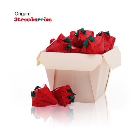 Origami sweet paper red isolated strawberries in basket on a white reflection backgroundの写真素材