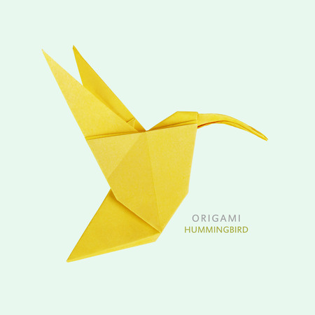Origami art hummingbird bird on blue backgroundの写真素材