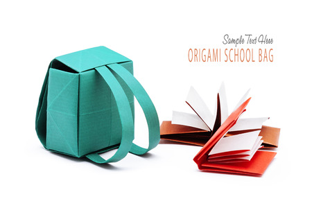 School backpack with education books origami set on a white backgroundの写真素材