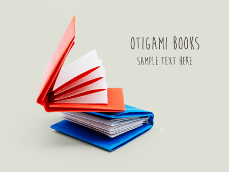 Origami education opened paper books on a gray backgroundの写真素材