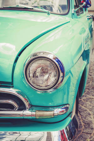 Antique vintage retro blue automobile bumper car front lightの写真素材