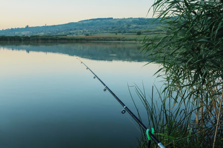 Lake holiday fishing rod and chair summer travel hobby morning sunriceの写真素材
