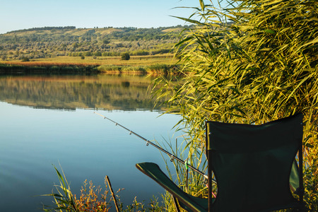 Lake holiday fishing rod and chair summer travel hobbyの写真素材