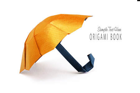 Origami yellow cartoon protection umbrella on a white backgroundの写真素材