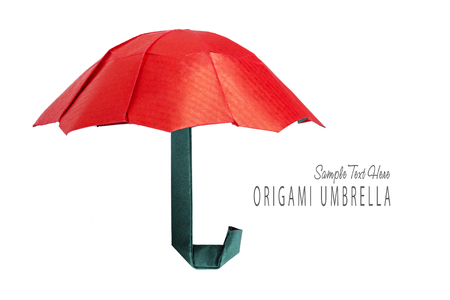 Origami red protection umbrella on a white backgroundの写真素材