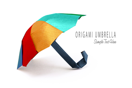 Origami red protection umbrella on a white backgroundの写真素材